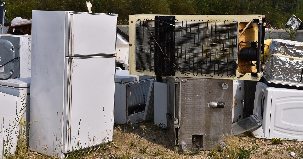 Discarded refrigerators at a disposal site highlighting the need for refrigerator disposal service Longmont